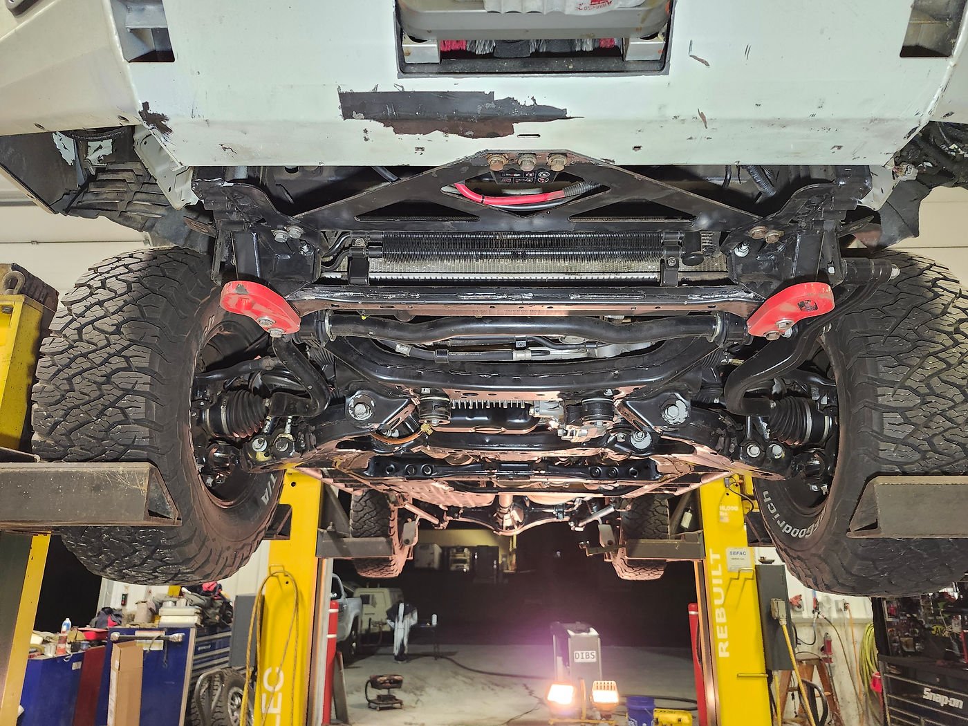 Same Toyota Land Cruiser undercarriage, bare clean metal after dry ice blasting